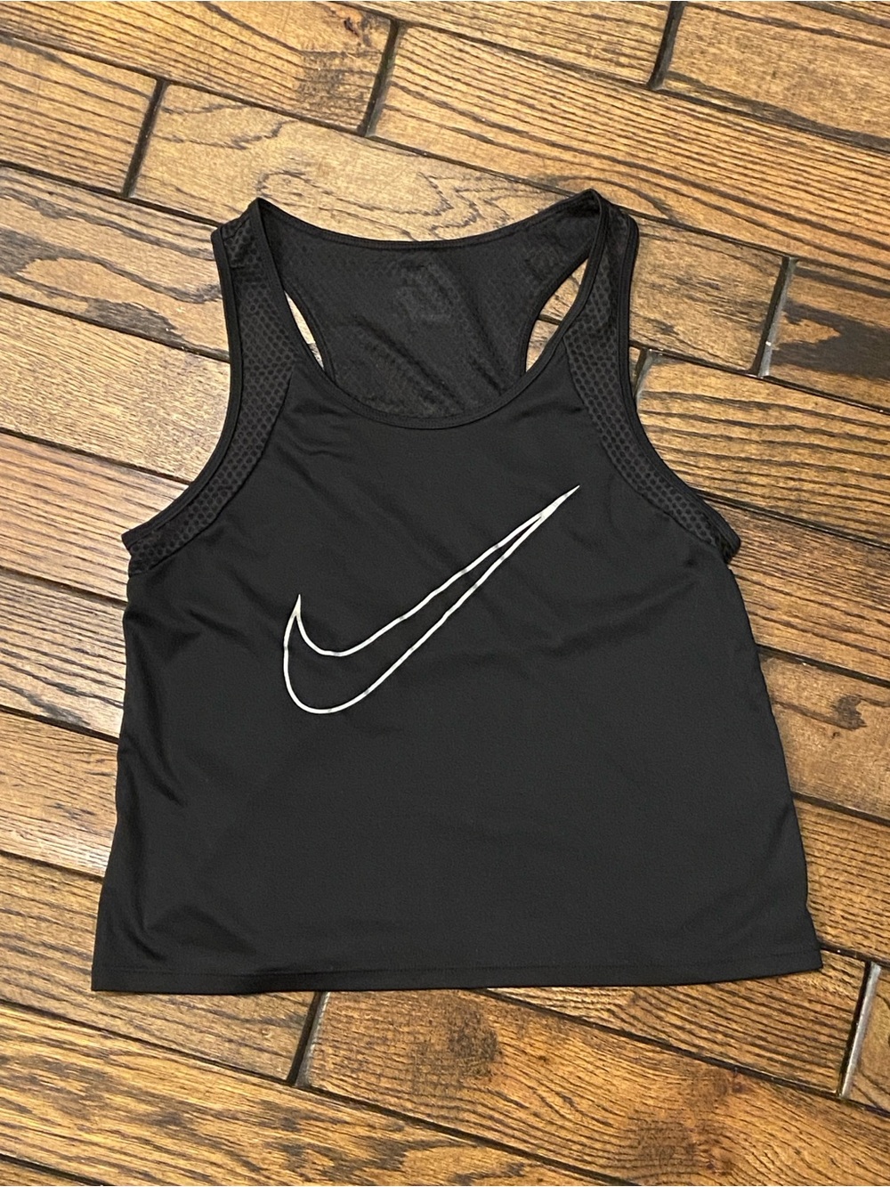 Nike black form-fitting dri-fit racerback tank top with white swoosh in size S